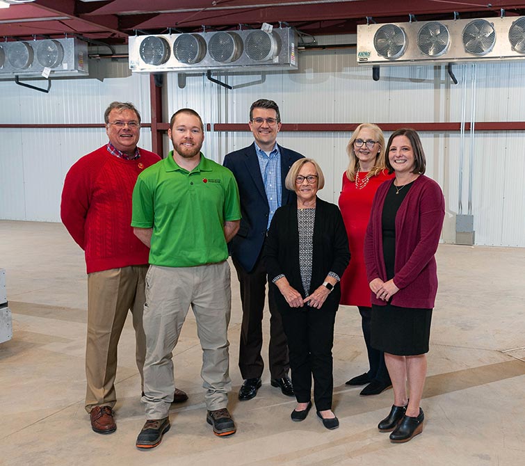 In the new cooler space ae, from left, Lions Club Teasurer Dave Pearson, River bend Food Bank Galesburg Branch Site Director Aaron Baron, Galesburg Community Foundation President & CEO Josh Gibb, FISH of Galesburg President Diane Copeland, Lions Club Past President Kim Norton, and FISH of Galesburg Executive Director Elizabeth Culbertson.