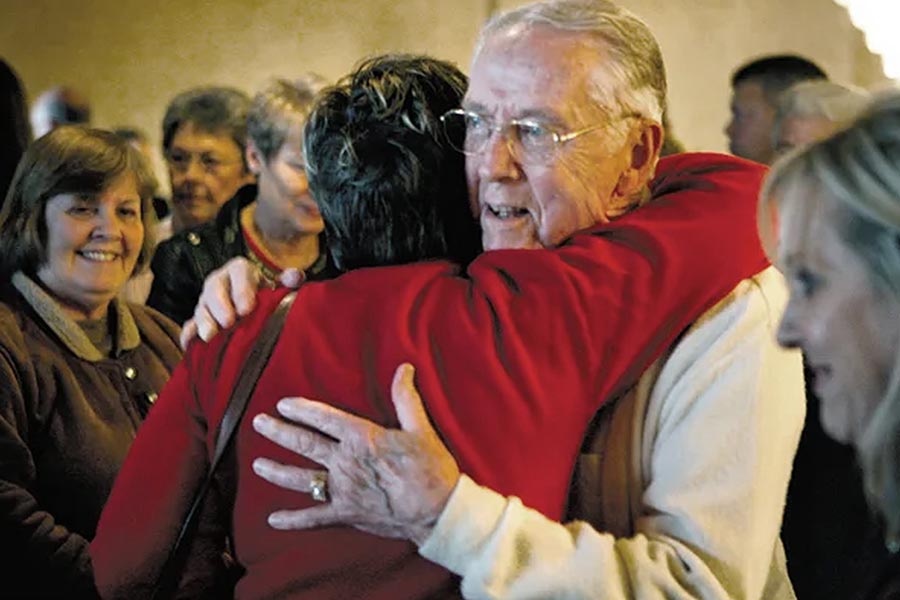 Jack Larson gets and gives a hug.
