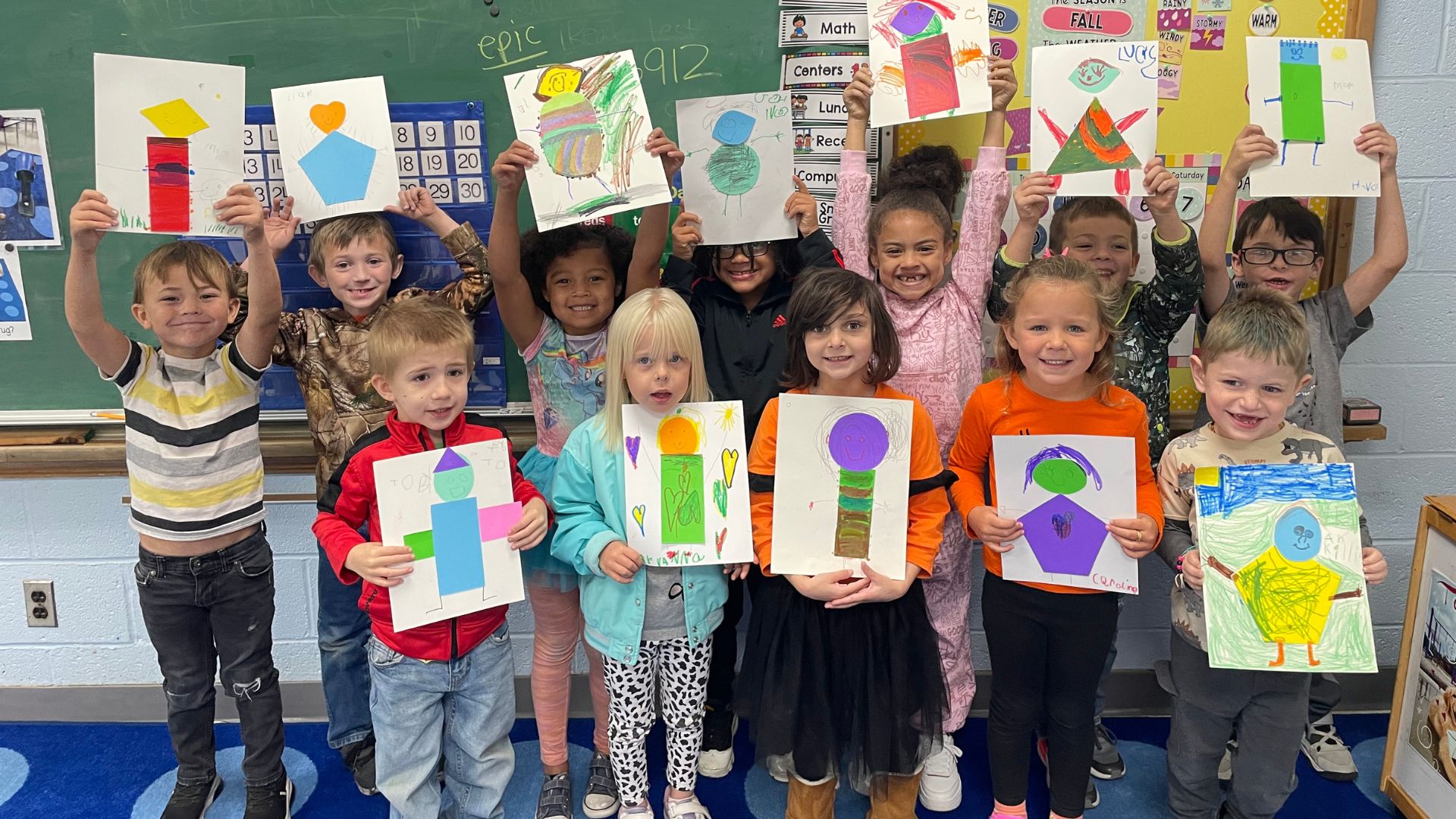 Elementary students show the art work created through Buchanan Center for the Arts Art Presenter program.